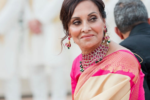 Elegant Indian bride in traditional attire with makeup by Glamour Girl in Chicago