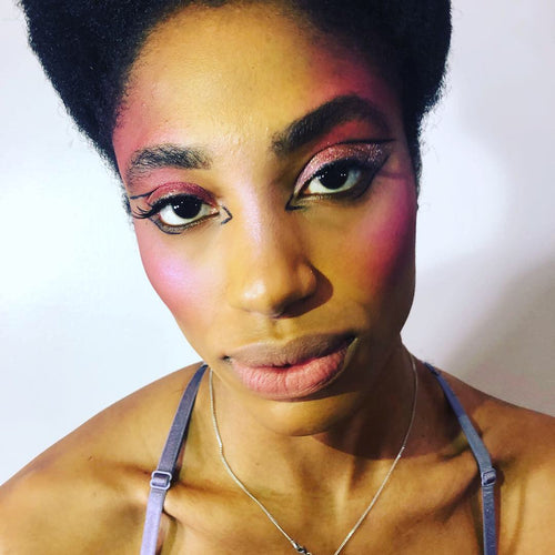 Unique graphic makeup by Glamour Girl Airbrush Tan on a model at NYFW.