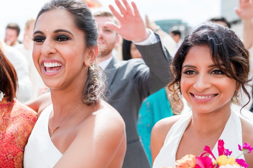 Candid laughter moment captured with bridal makeup by Glamour Girl in Chicago