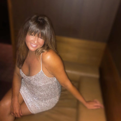 Radiant tan highlighted by a sparkling dress, thanks to Glamour Girl Airbrush Tan, at a Chicago event.