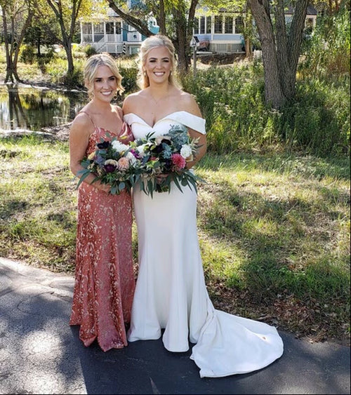 Bride and bridesmaid posing outdoors in Chicago, their happiness matched by their perfect Glamour Girl Airbrush Tans.