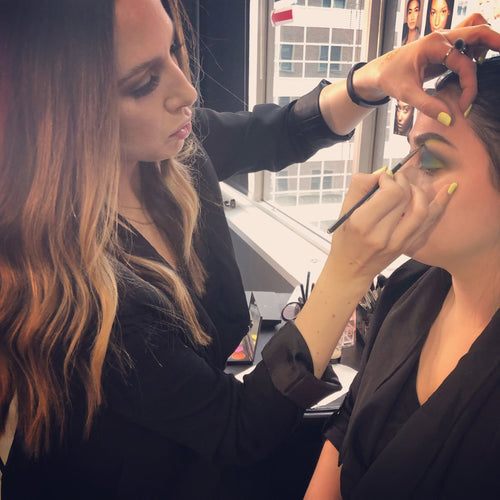 Glamour Girl makeup artist creating a vibrant editorial makeup look in Chicago salon